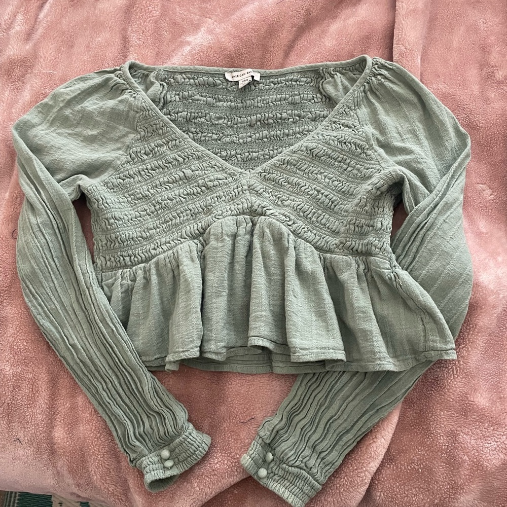 Springy shirt haha stretchy and cute, just not my style. Worn once or twice!